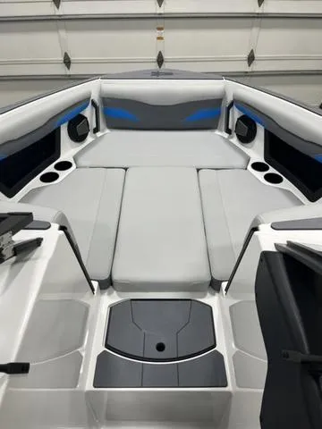 Slide: The Image of 2024 Axis Wake Research T235 boat interior with cushioned seating and cup holders. - 10