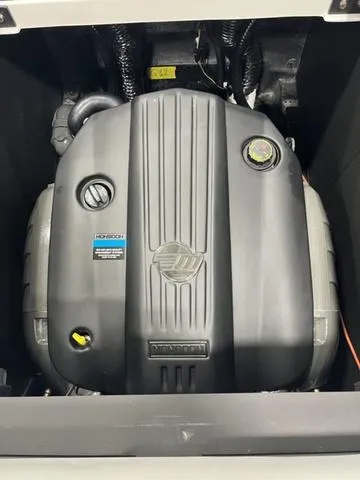 Slide: The Image of 2024 Axis Wake Research T235 engine compartment, showcasing a powerful inboard motor. - 11