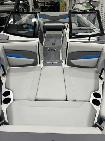Slide: The Image of 2024 Axis Wake Research T235 boat interior with modern seating and cup holders. - 5