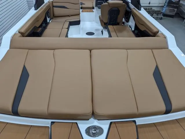 Slide: The Image of 2025 Axis Wake Research T220 boat interior with tan seating and modern design. - 4
