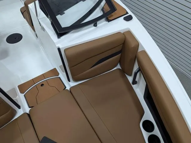 Slide: The Image of 2025 Axis Wake Research T220 boat interior with brown seating and modern design. - 8