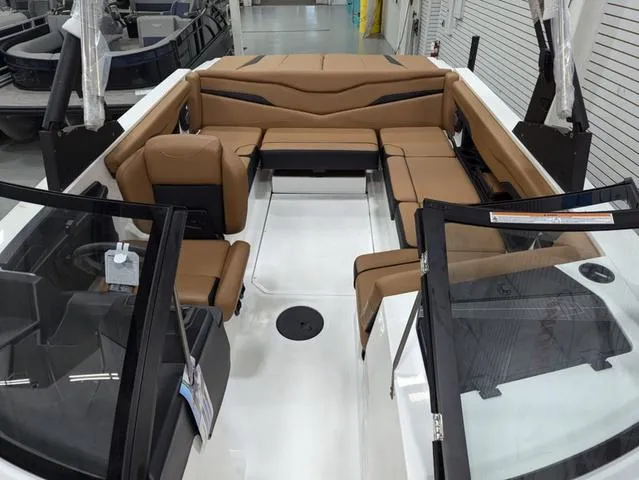 Slide: The Image of 2025 Axis Wake Research T220 boat interior with tan seating and modern design. - 9