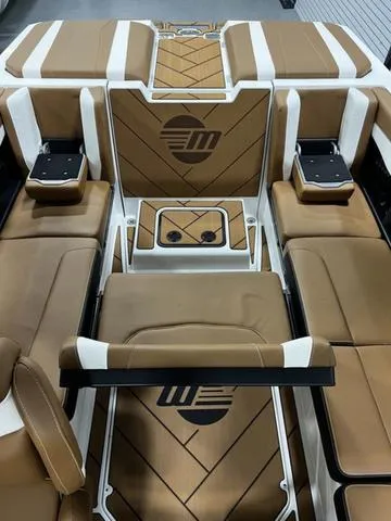 Slide: The Image of 2024 Malibu 22 LSV interior with luxurious brown and white seating. - 19
