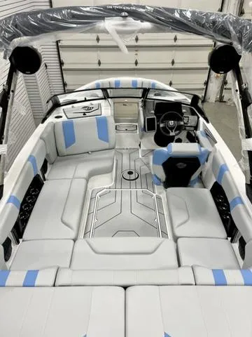 Slide: The Image of 2024 Malibu 21 LX boat interior with modern design and blue accents. - 6