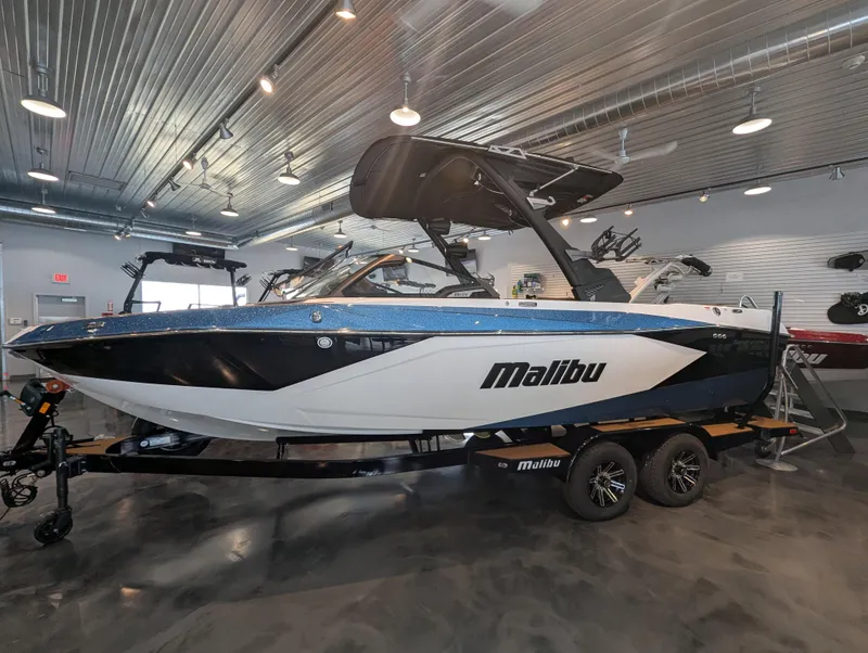 The Image of 2025 Malibu Wakesetter 23 LSV boat displayed in a showroom with sleek design. - 0