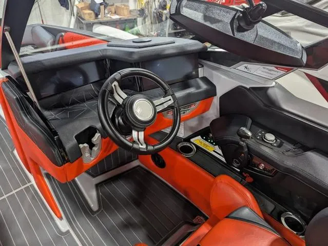 Slide: The Image of Interior of 2020 Nautique G23 Paragon boat with red and black seating. - 11