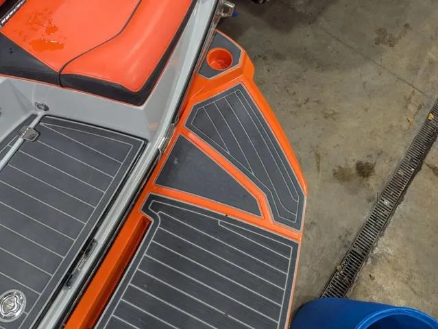 Slide: The Image of 2020 Nautique G23 Paragon boat with orange and gray deck detail. - 15
