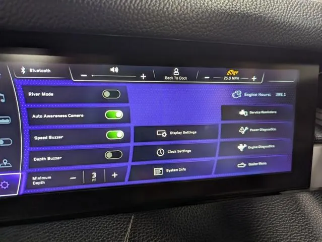 Slide: The Image of 2020 Nautique G23 Paragon dashboard display with various control settings and diagnostics. - 25