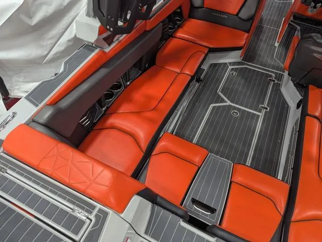 Slide: The Image of 2020 Nautique G23 Paragon interior with orange seating and sleek design. - 27