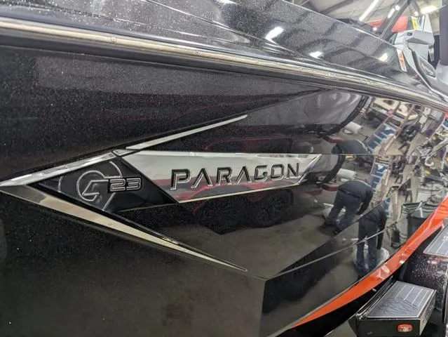 Slide: The Image of 2020 Nautique G23 Paragon boat with sleek black exterior design. - 3