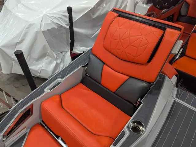 Slide: The Image of 2020 Nautique G23 Paragon boat seat with orange and gray upholstery. - 31
