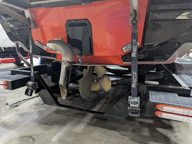 Slide: The Image of 2020 Nautique G23 Paragon boat propeller and exhaust system on trailer. - 34