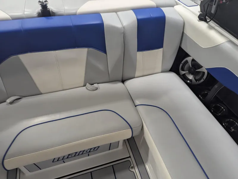 Slide: The Image of 2021 Malibu Wakesetter 20 VTX interior with blue and gray seating. - 11