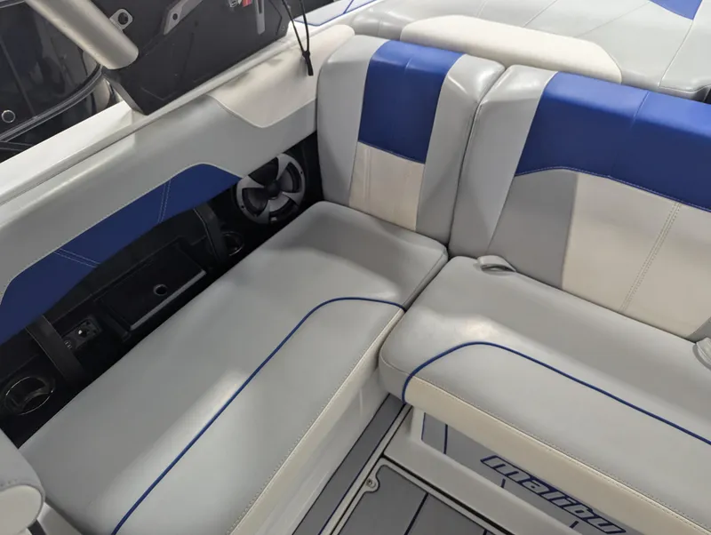 Slide: The Image of Interior seating of 2021 Malibu Wakesetter 20 VTX boat, featuring blue and gray upholstery. - 12