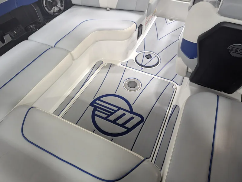 Slide: The Image of 2021 Malibu Wakesetter 20 VTX interior with sleek seating and stylish flooring design. - 13