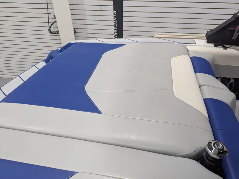 Slide: The Image of 2021 Malibu Wakesetter 20 VTX boat interior with blue and gray upholstery. - 14