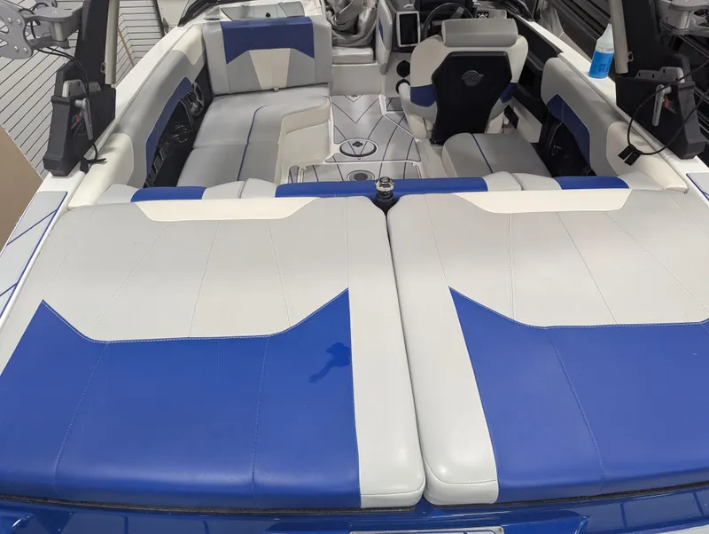Slide: The Image of 2021 Malibu Wakesetter 20 VTX interior with blue and white seating. - 15