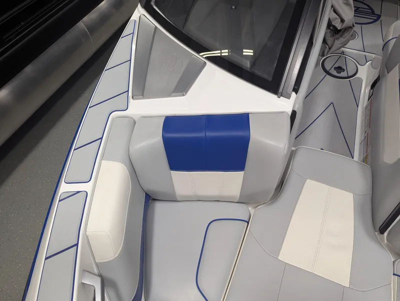 Slide: The Image of 2021 Malibu Wakesetter 20 VTX interior with blue and white seating. - 17