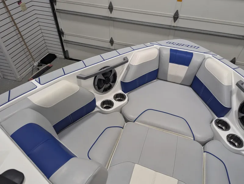 Slide: The Image of 2021 Malibu Wakesetter 20 VTX boat interior with blue and gray seating. - 6