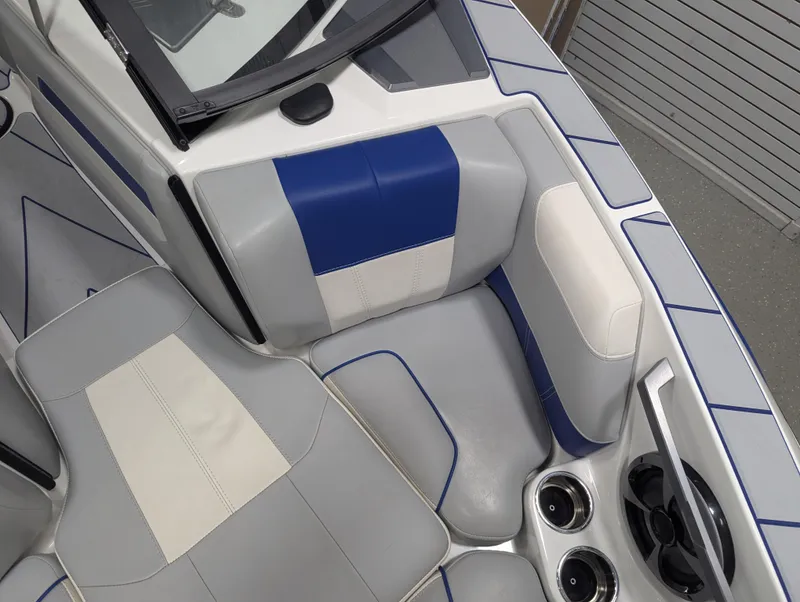 Slide: The Image of 2021 Malibu Wakesetter 20 VTX interior with blue and gray seating. - 7