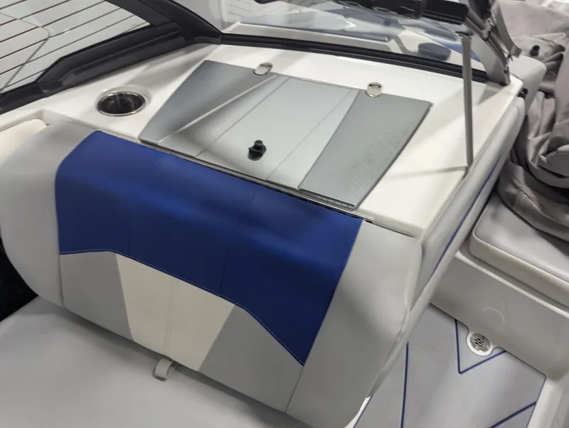 Slide: The Image of 2021 Malibu Wakesetter 20 VTX boat interior with blue and white seating. - 9