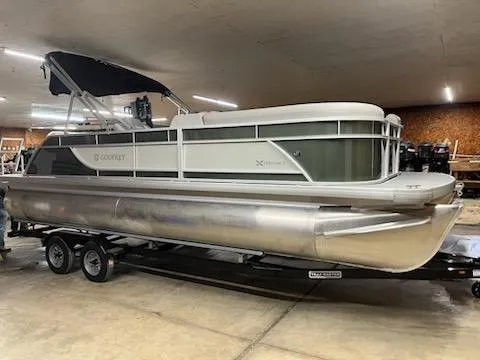 The Image of 2025 Godfrey 2286SFLX pontoon boat on trailer in indoor storage. - 0