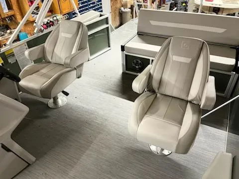 Slide: The Image of 2025 Godfrey 2286SFLX boat interior with plush seating and modern design. - 14