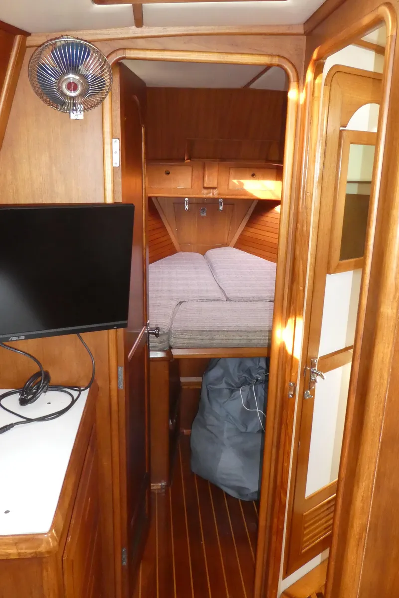 Slide: The Image of Interior of 1990 Celestial 48 Center Cockpit with cozy cabin and wooden finishes. - 27