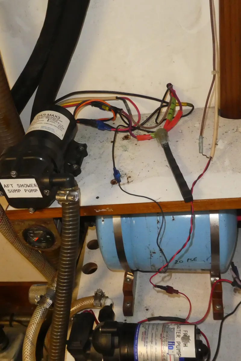 Slide: The Image of Electrical wiring and components inside a 1990 Celestial 48 Center Cockpit boat. - 36
