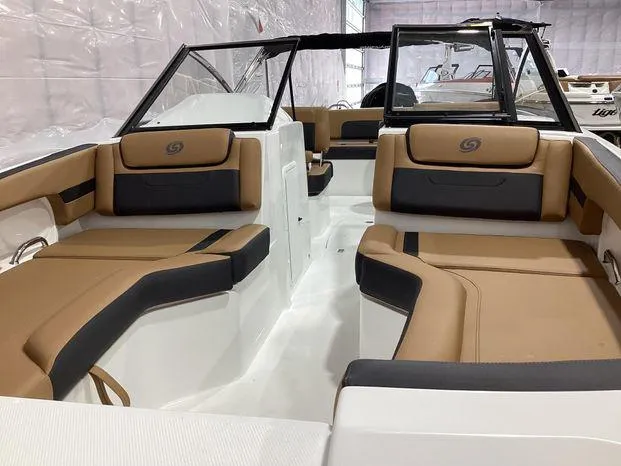 Slide: The Image of 2024 Hurricane SD235-OB boat interior with tan and black seating, spacious layout. - 11