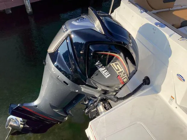Slide: The Image of 2024 Hurricane SD235-OB boat with Yamaha outboard motor in water. - 4