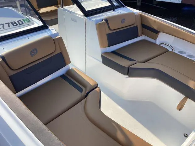 Slide: The Image of 2024 Hurricane SD235-OB boat interior with tan and black seating. - 7