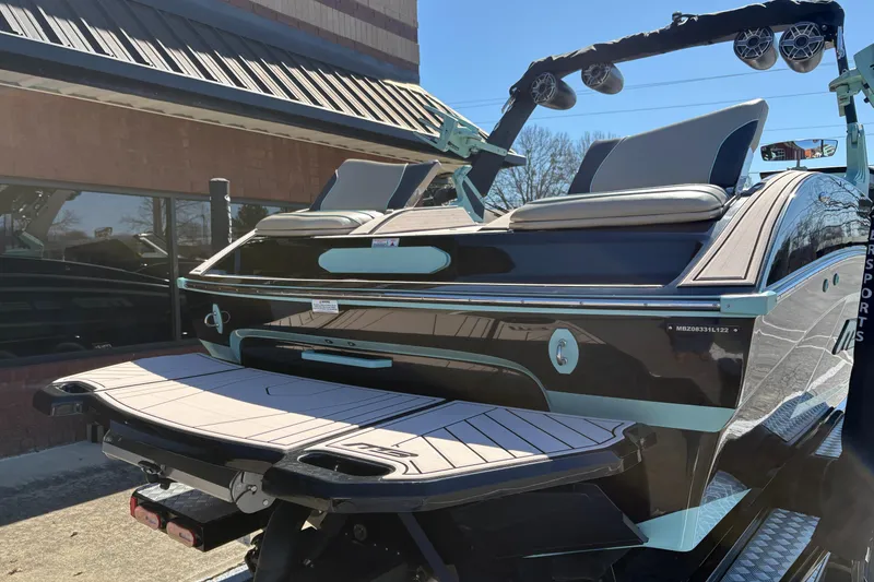 Slide: The Image of 2022 MB B52 Alpha boat with sleek design and modern features, parked outdoors. - 12