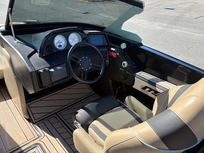 Slide: The Image of 2022 MB B52 Alpha boat interior with steering wheel and dashboard controls. - 7