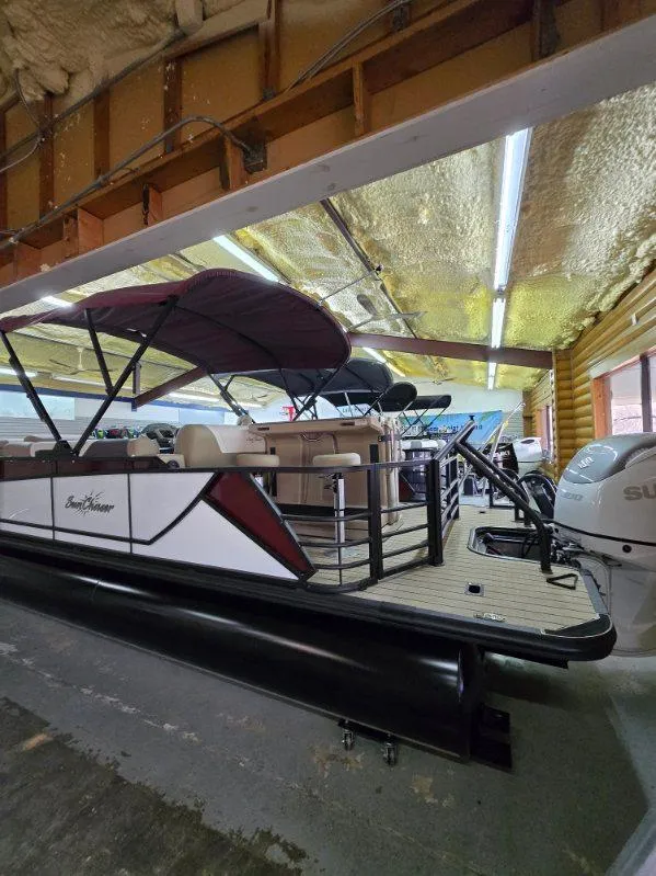 Slide: The Image of 2025 SunChaser Eclipse 23 SBX DH pontoon boat in a storage facility. - 5