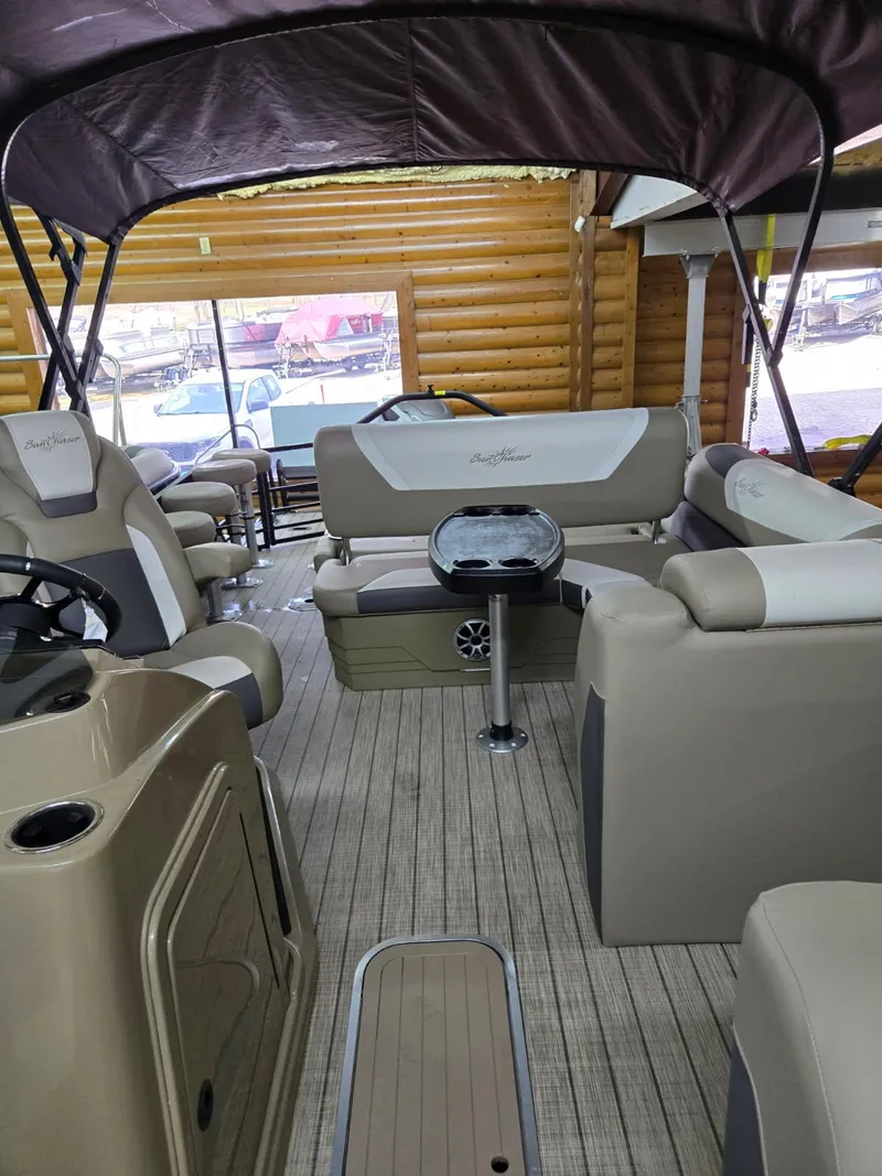 Slide: The Image of 2025 SunChaser Eclipse 23 SBX DH pontoon boat interior with seating and table. - 7