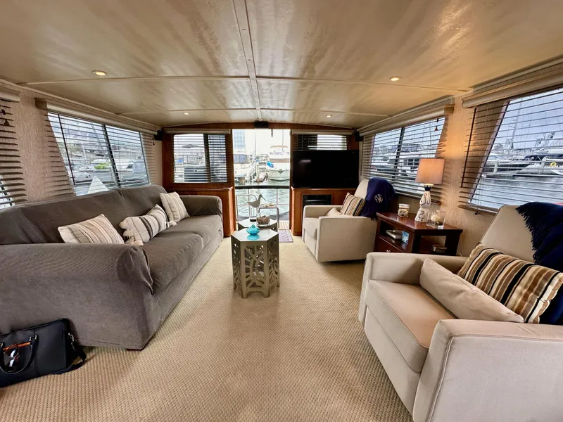 Slide: The Image of Luxurious interior of 1985 Gulfstar 49 Motor Yacht with cozy seating and elegant decor. - 26