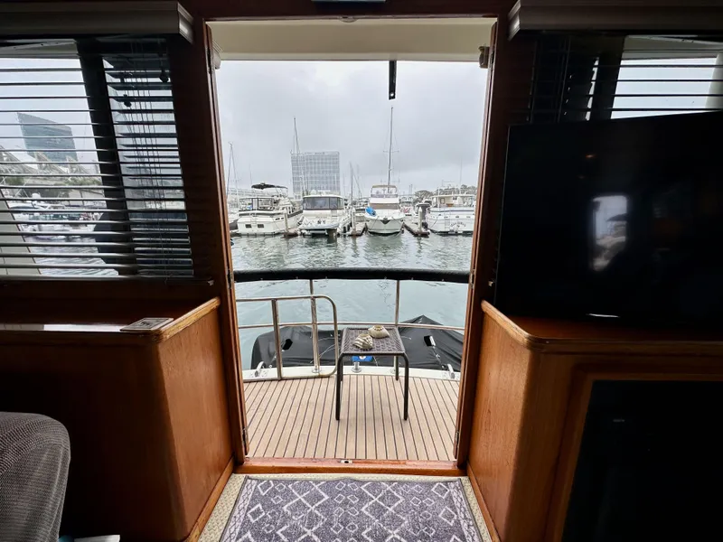 Slide: The Image of Interior view from 1985 Gulfstar 49 Motor Yacht overlooking marina with boats. - 28