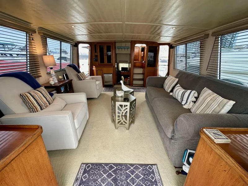 Slide: The Image of Interior of 1985 Gulfstar 49 Motor Yacht, featuring cozy seating and elegant decor. - 34
