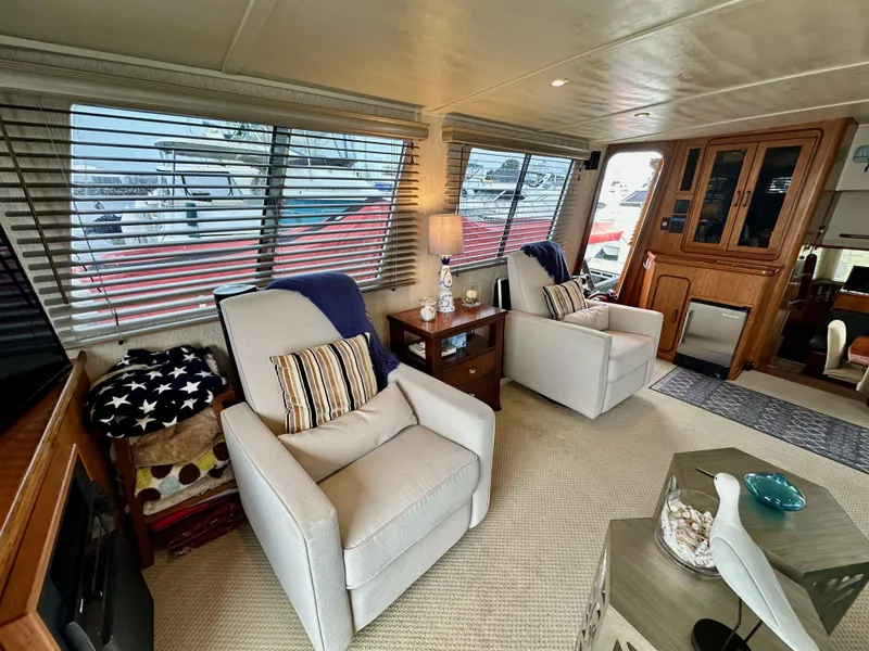 Slide: The Image of Interior of 1985 Gulfstar 49 Motor Yacht with cozy seating and nautical decor. - 35