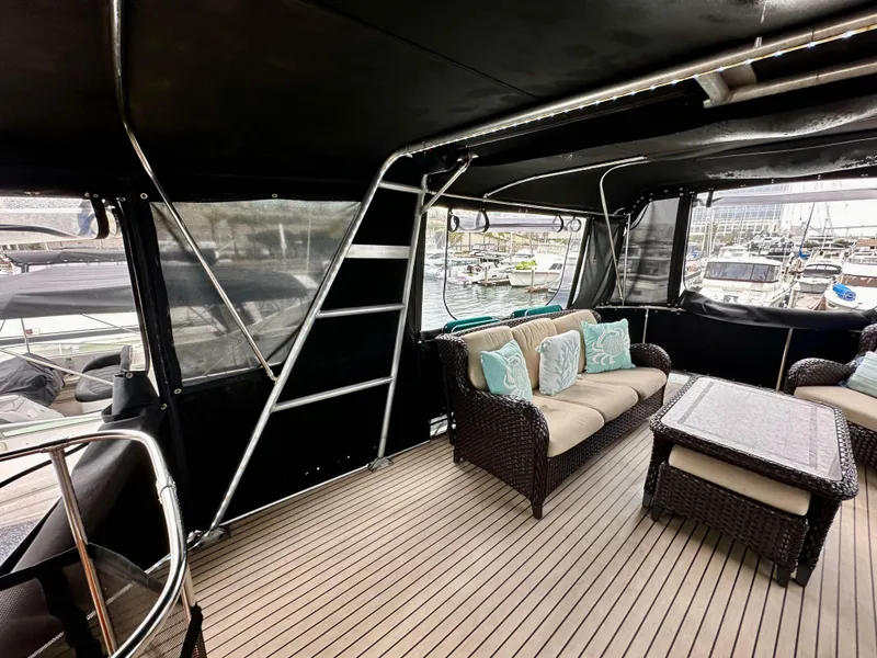 Slide: The Image of Luxurious 1985 Gulfstar 49 Motor Yacht interior with comfortable seating and elegant design. - 46