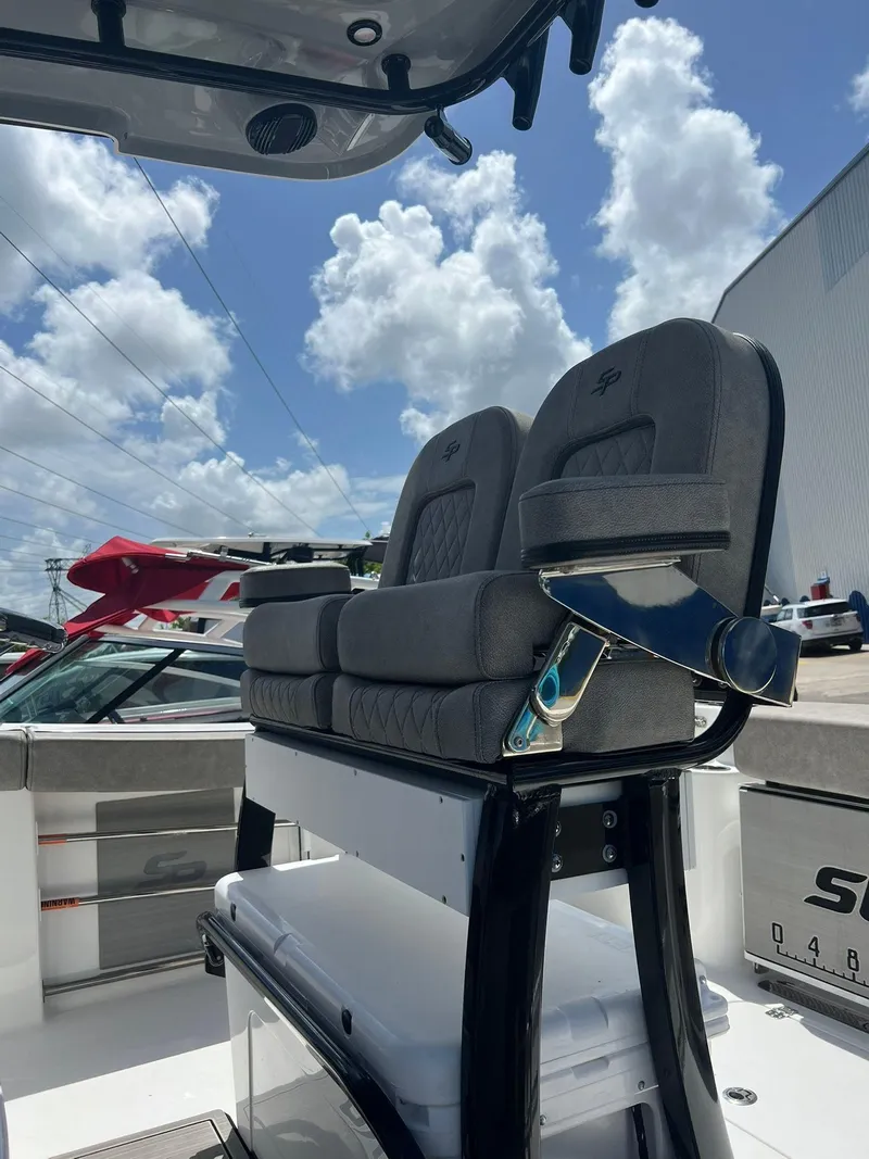 Slide: The Image of 2023 Sea Pro 239 Deluxe CC boat seats under a sunny sky. - 28