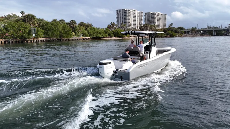 Slide: The Image of 2023 Sea Pro 239 Deluxe CC boat cruising on a scenic waterway. - 4
