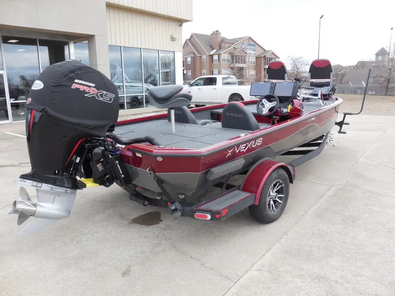 Slide: The Image of 2023 Vexus AVX1980 boat with Mercury Pro XS engine, parked outdoors. - 3