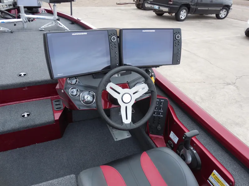 Slide: The Image of 2023 Vexus AVX1980 boat cockpit with dual monitors and steering wheel. - 7