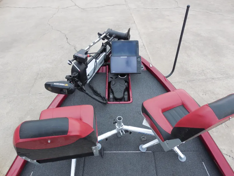 Slide: The Image of 2023 Vexus AVX1980 boat interior with red seats and advanced navigation equipment. - 8