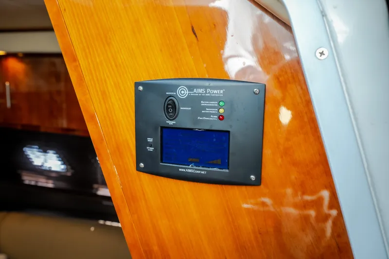 Slide: The Image of Control panel on 2012 Regal 42 Sport Coupe yacht interior, featuring AIMS Power inverter. - 61