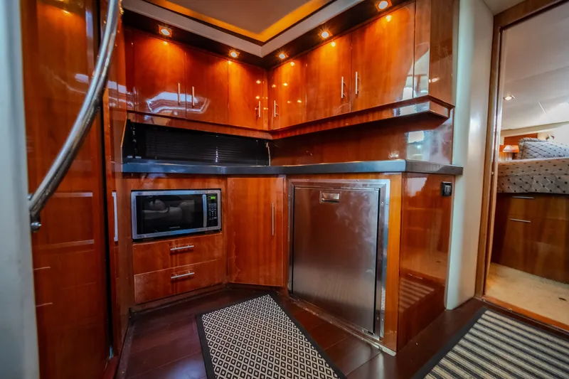 Slide: The Image of Luxurious 2012 Regal 42 Sport Coupe yacht interior with modern kitchen amenities. - 49