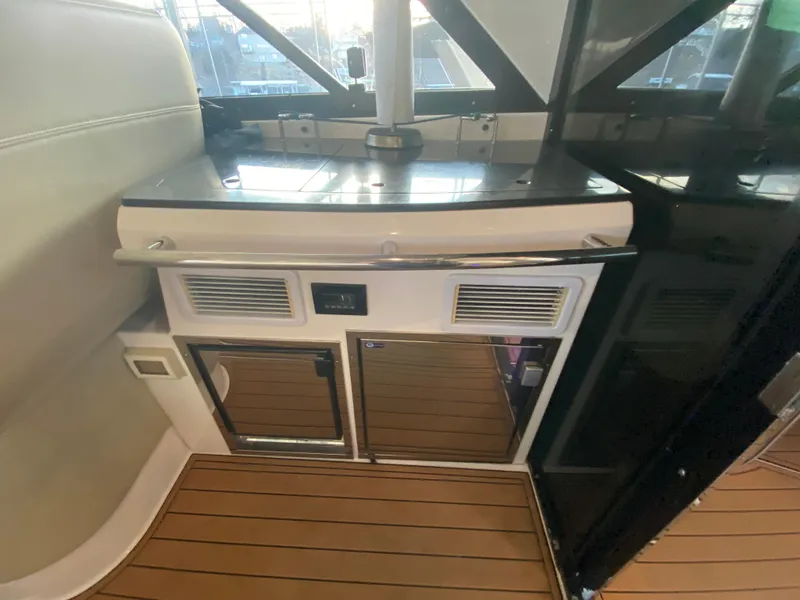 Slide: The Image of 2012 Regal 42 Sport Coupe interior with sleek cabinetry and modern design. - 15