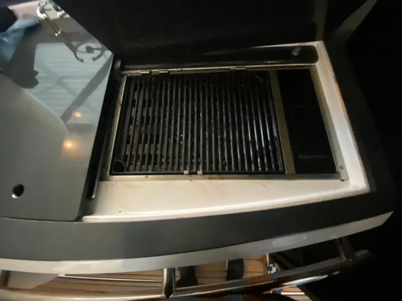 Slide: The Image of Outdoor grill on a 2012 Regal 42 Sport Coupe yacht. - 16